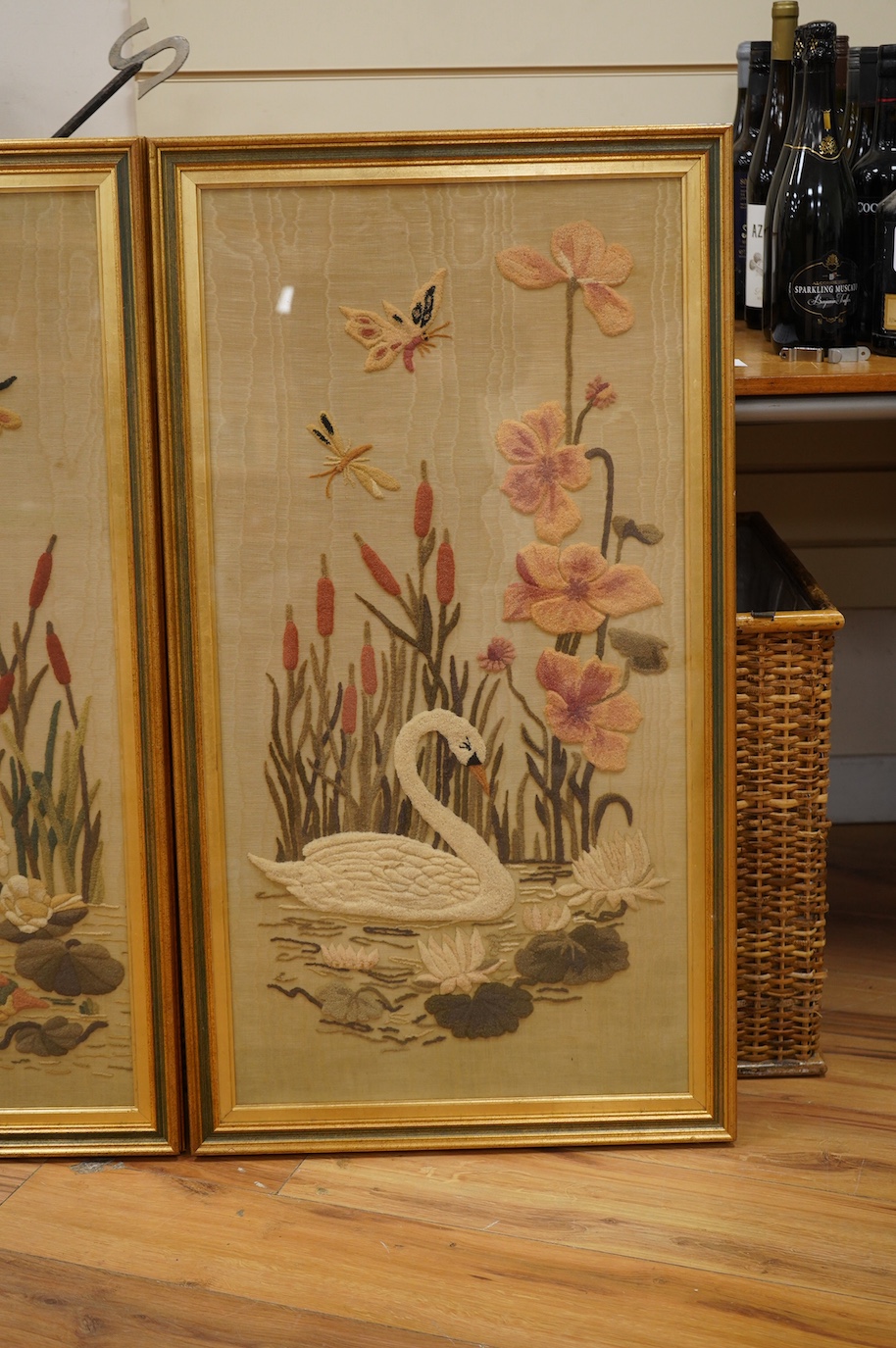 A pair of watered silk and relief felt panels, Birds amongst flowers and insects, 86 x 43cm. Condition - fair